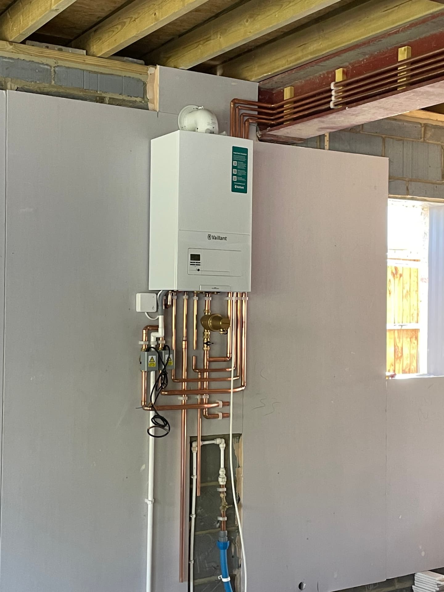 Close-up of copper heating pipework installed by Phaze One